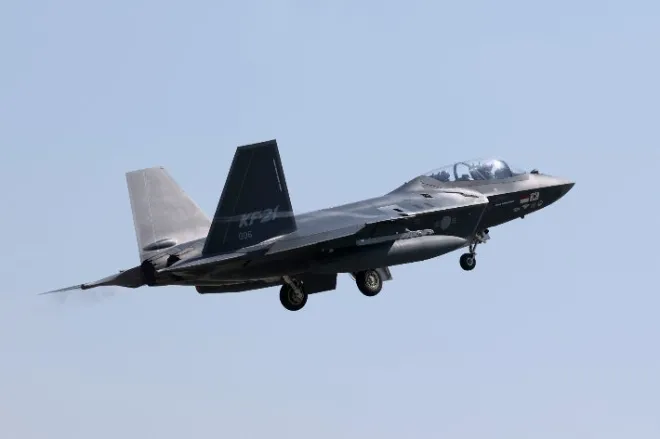 Does transferring the fifth prototype of the KF-21 fighter jet to Indonesia benefit national interests?